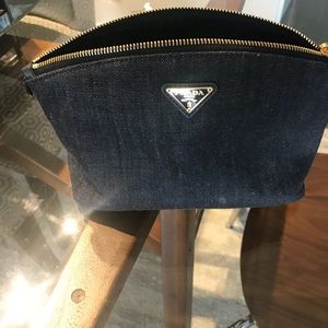 BLACK  IN COLOR ((JEANS)) PRADA MAKE UP BAG .